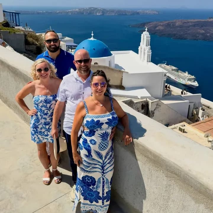 Jake Sorce with friends on a terrace in Santorini, Greece
